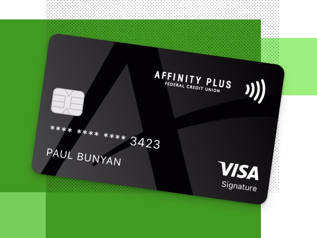 Black Affinity Plus credit card on a green background