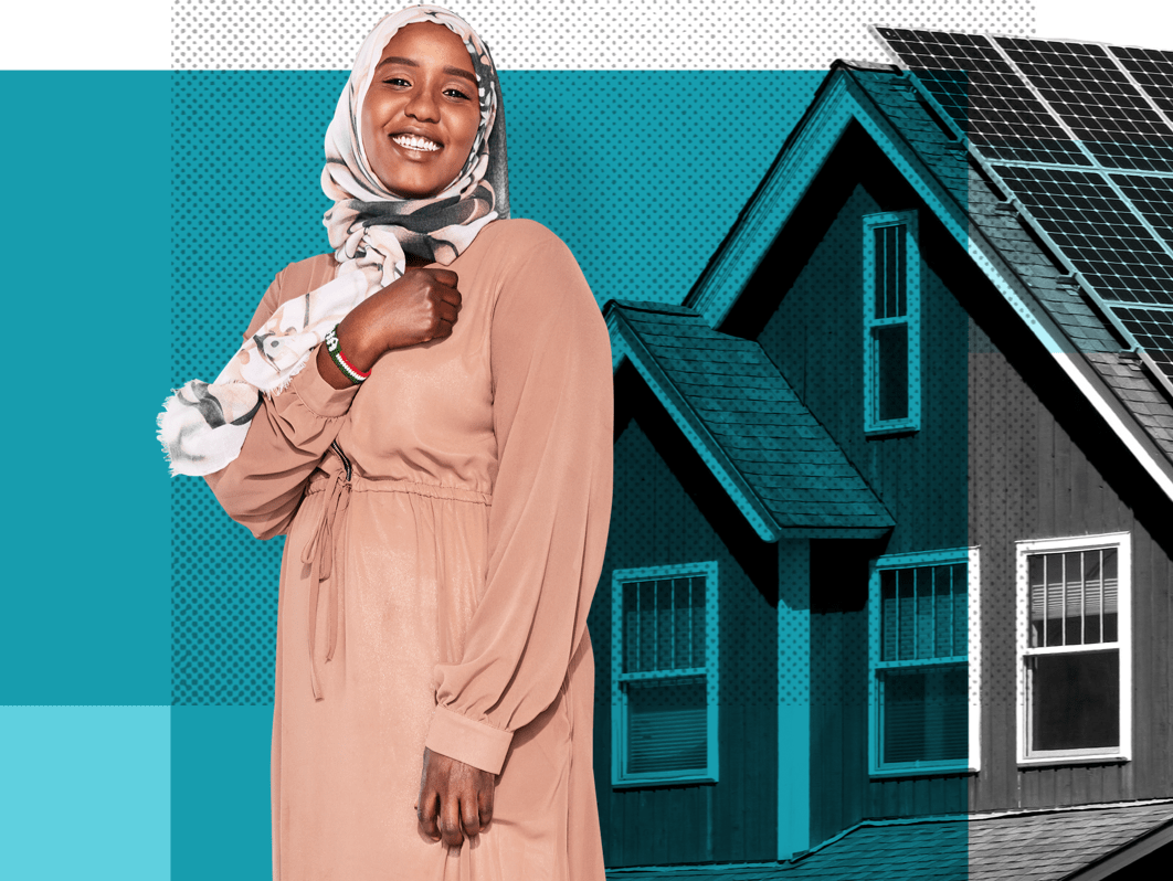 Asha, a Minnesota resident, in front of a home with solar panels.