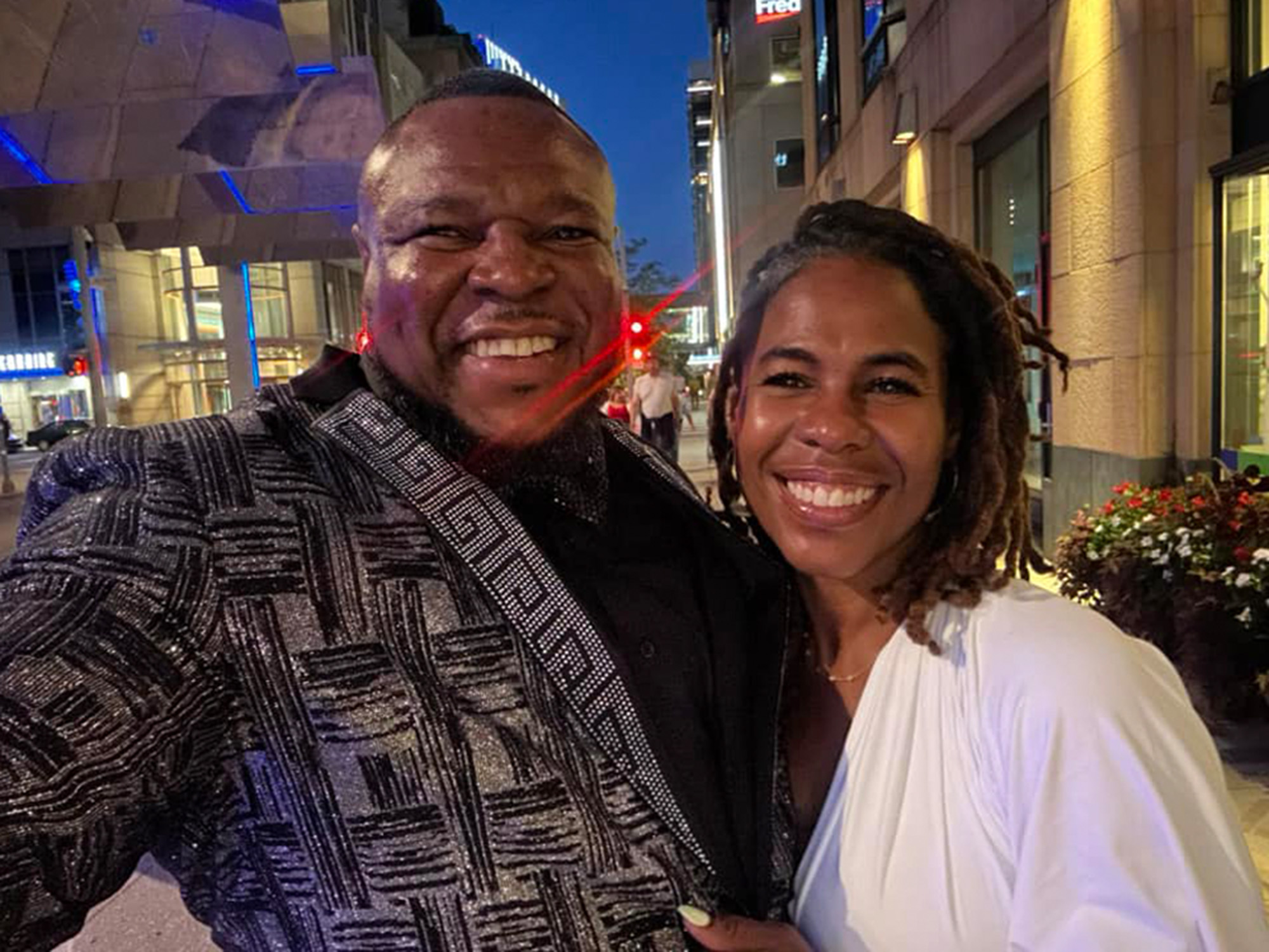 a man and woman posing in the streets