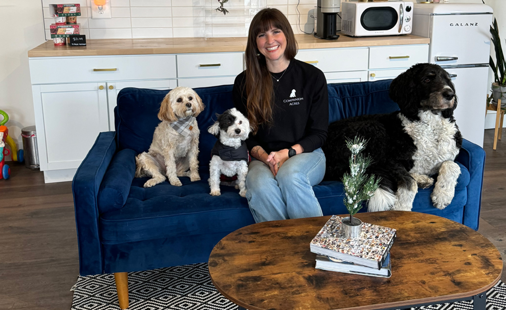 Allison Kocak with dogs on a couch