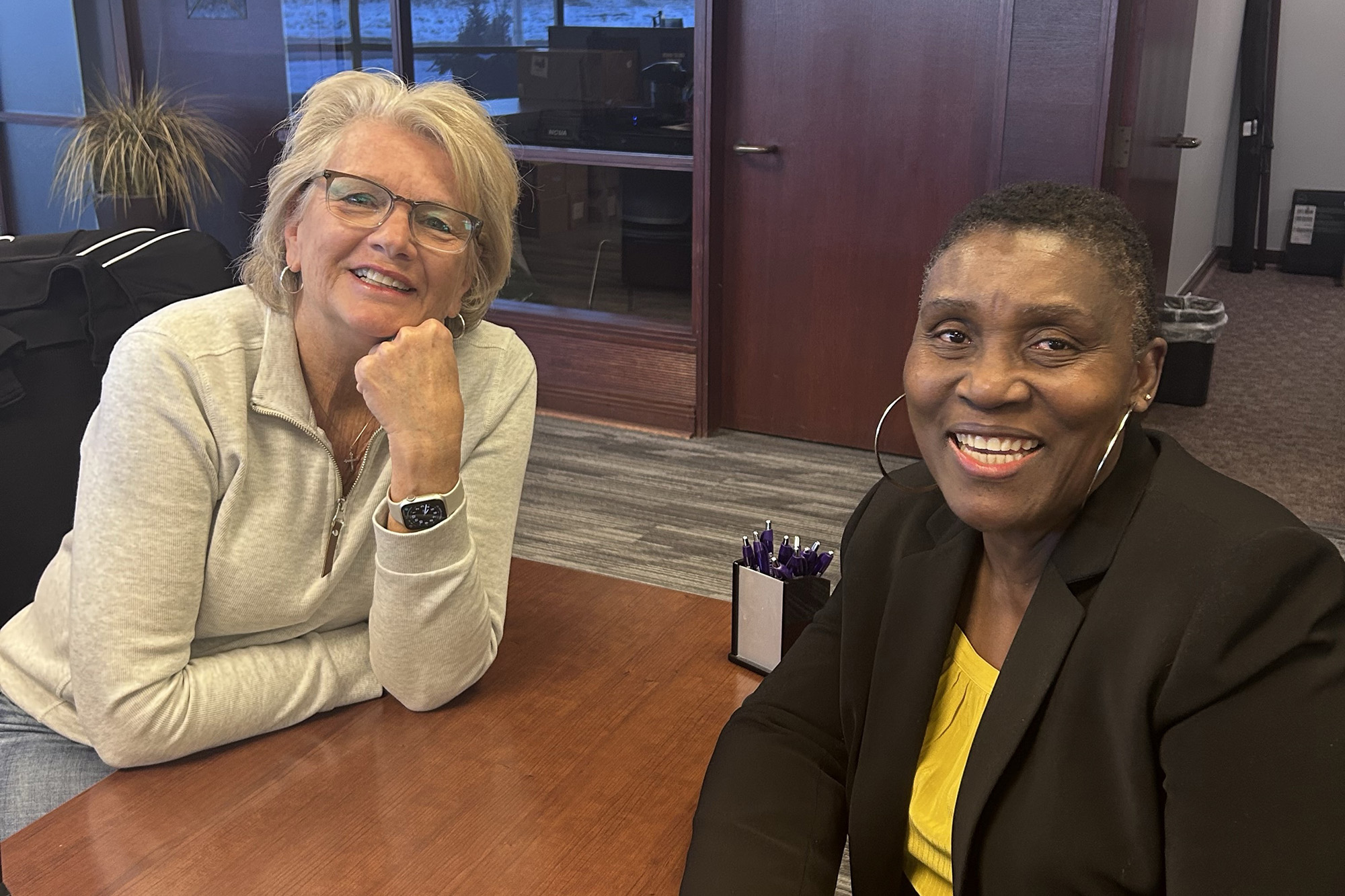 Sandy Olson, Senior Member Consultant smiling with Affinity Plus Member Bea