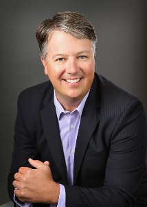 Dave Larson smiles for headshot photo for Affinity Plus Federal Credit Union.