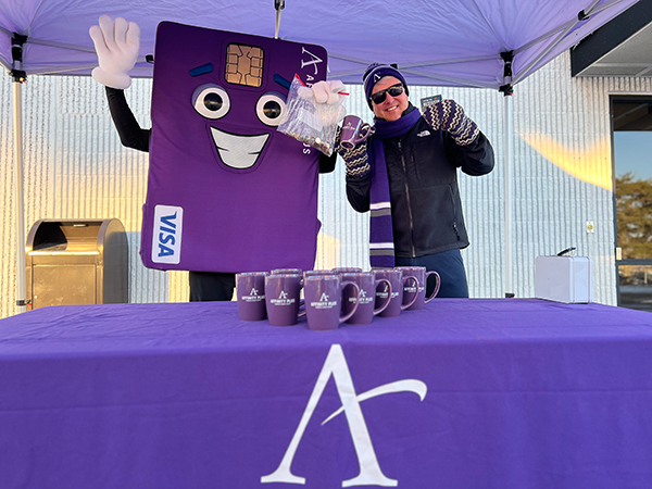 Affinity Plus Mascot and Affinity Plus CEO, Dave Larson, holding gift card and coffee cup