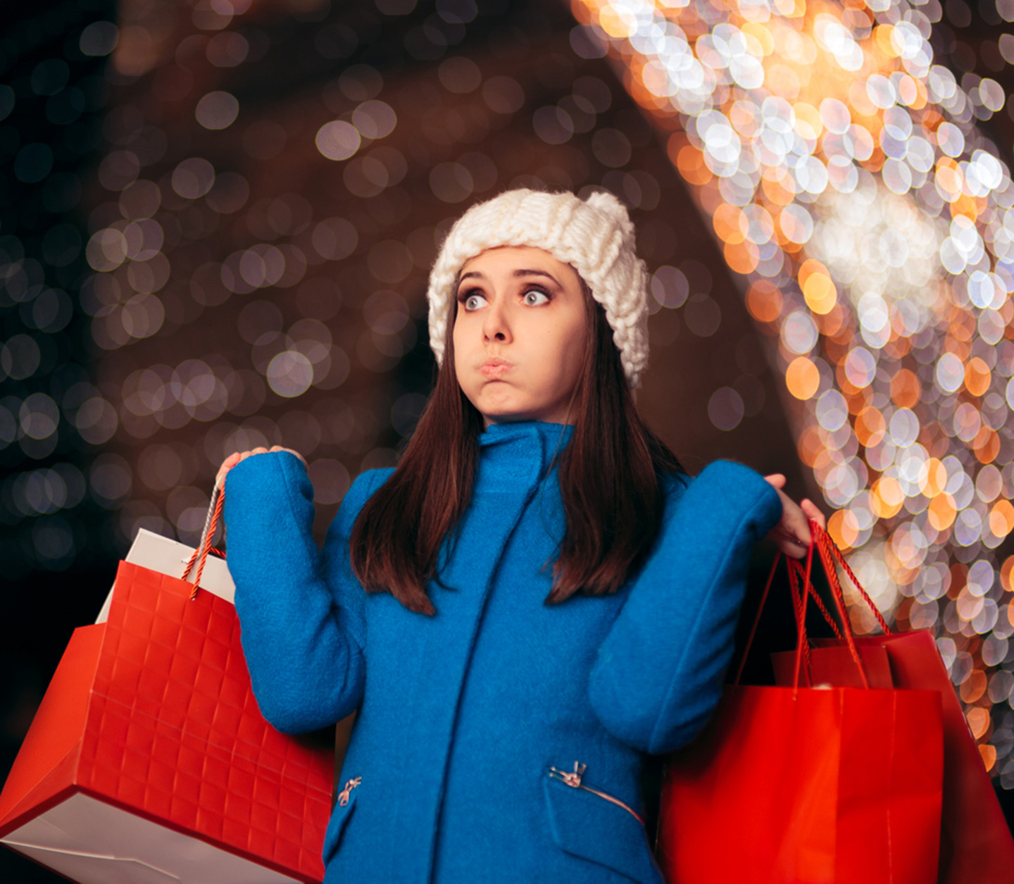 A woman holding two shopping bags