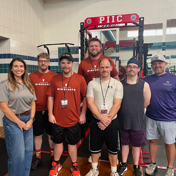a group of people in a gym setting