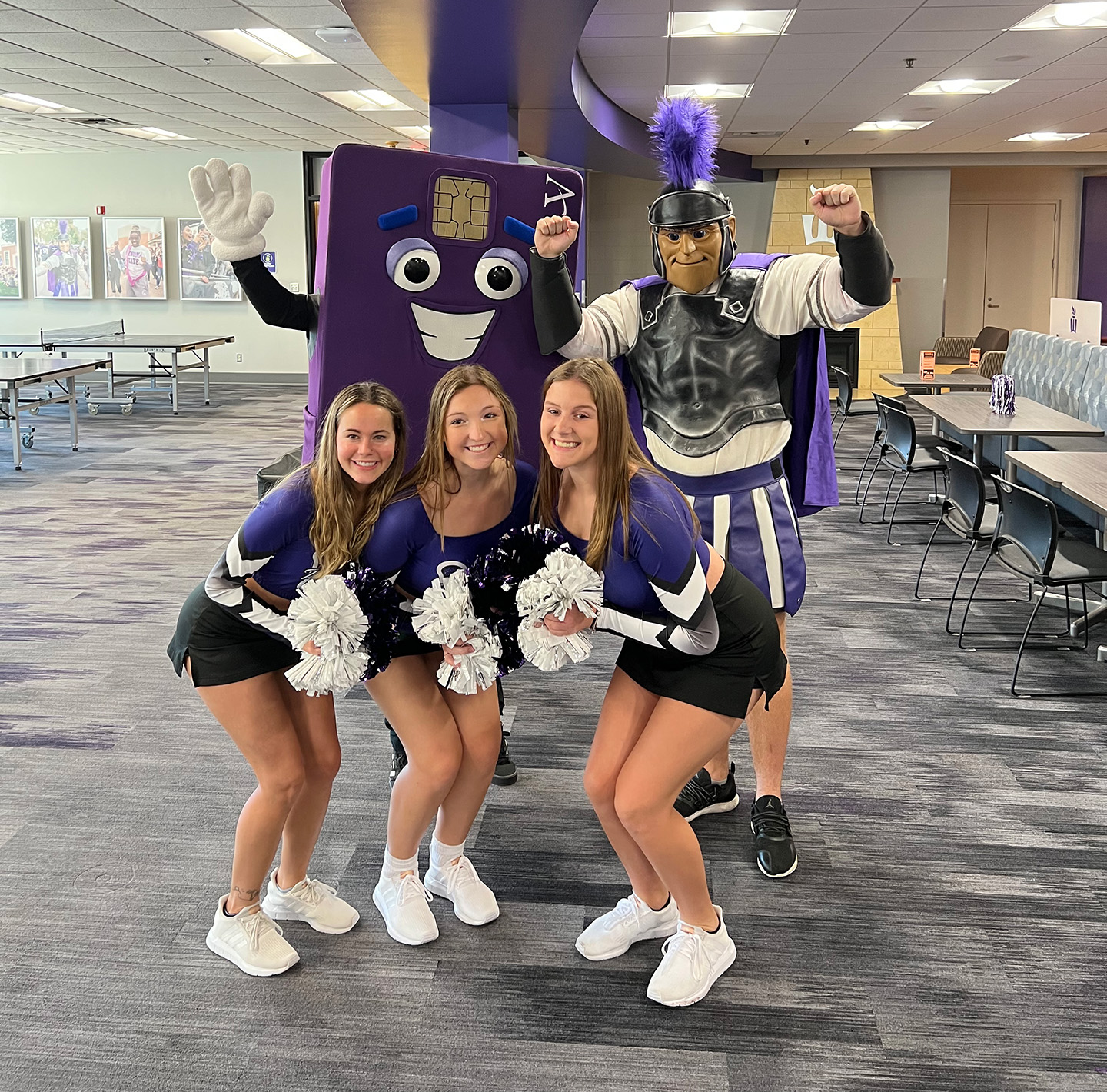 Affinity Plus Mascot and Winona State Mascot with the WSU Cheerleaders